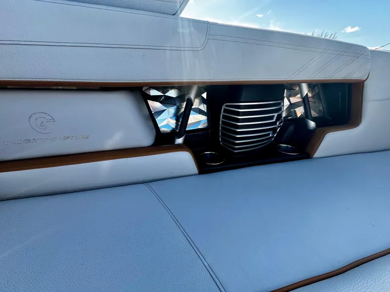 Slide: The Image of 2020 Nautique Super Air Nautique G25 Coastal Edition interior with sleek white seating and stylish accents. - 27