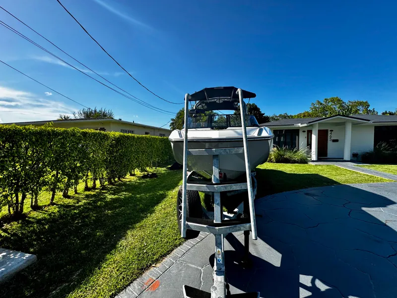 Slide: The Image of 2020 Nautique Super Air Nautique G25 Coastal Edition on trailer in residential driveway. - 28