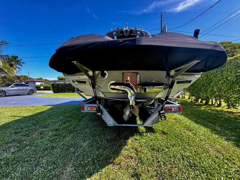 Slide: The Image of 2020 Nautique Super Air Nautique G25 Coastal Edition on trailer, rear view. - 29