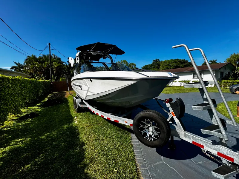 Slide: The Image of 2020 Nautique Super Air Nautique G25 Coastal Edition on trailer in residential driveway. - 4
