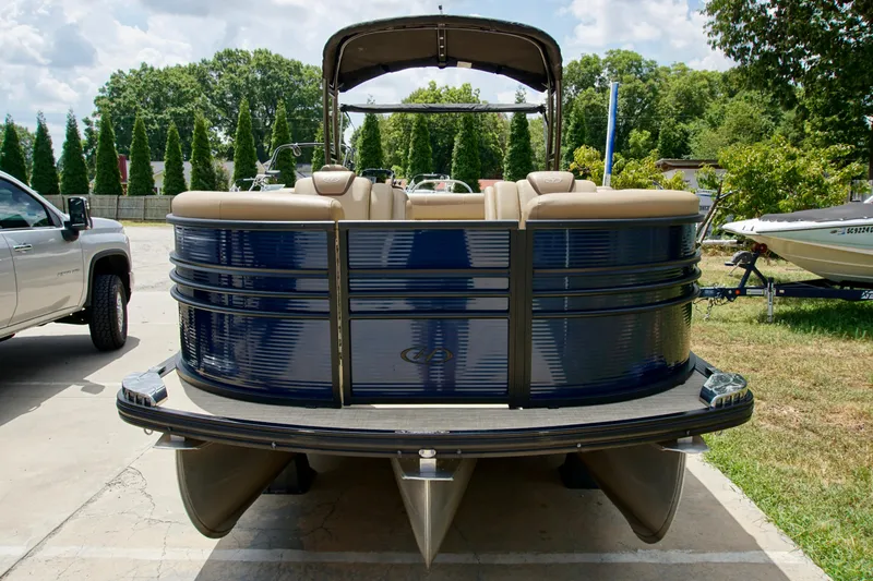 Slide: The Image of 2020 Harris Grand Mariner 230 pontoon boat parked outdoors on a sunny day. - 3