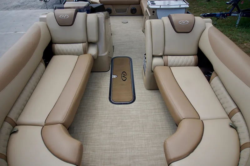 Slide: The Image of 2020 Harris Grand Mariner 230 interior with beige leather seating and modern design. - 8