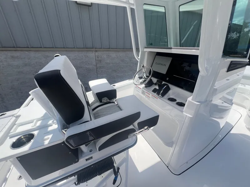 Slide: The Image of 2026 Blackfin 262 HB boat helm with Garmin display and comfortable seating. - 14