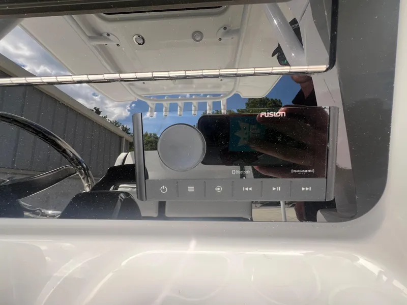 Slide: The Image of 2026 Blackfin 262 HB boat dashboard with Fusion audio system and Bluetooth connectivity. - 15