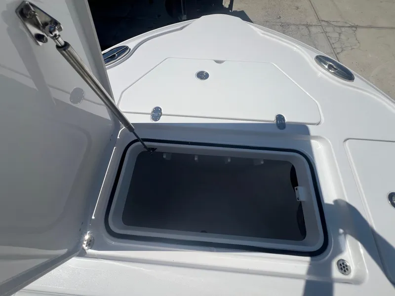 Slide: The Image of Open storage compartment on 2026 Blackfin 262 HB boat deck. - 18