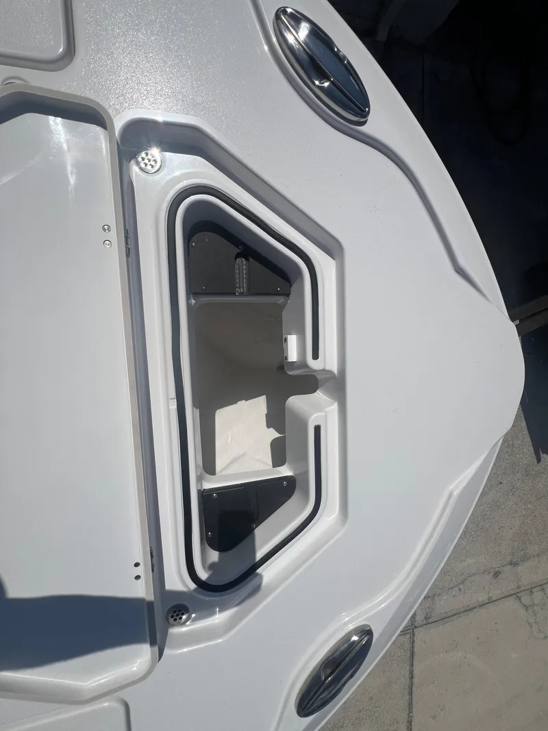 Slide: The Image of Open storage compartment on 2026 Blackfin 262 HB boat deck. - 21