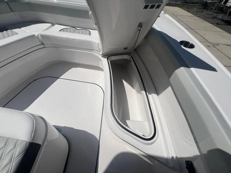 Slide: The Image of 2026 Blackfin 262 HB boat interior with open storage compartment. - 22