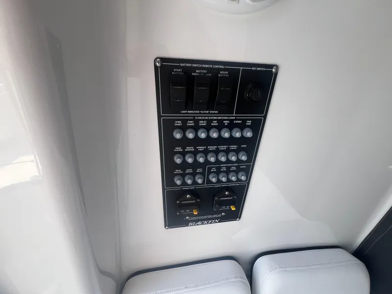 Slide: The Image of Control panel of 2026 Blackfin 262 HB boat with switches and indicators. - 27