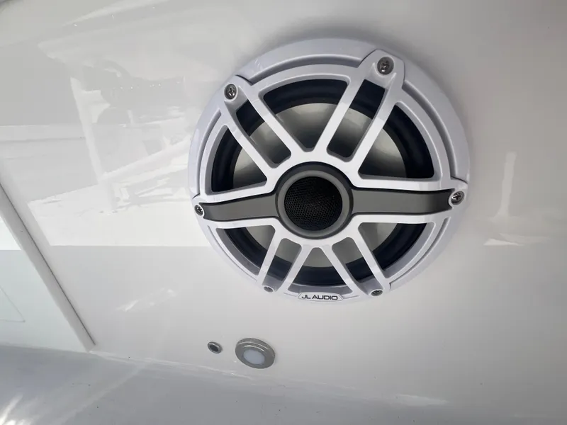 Slide: The Image of White JL Audio speaker on 2026 Blackfin 262 HB boat. - 29