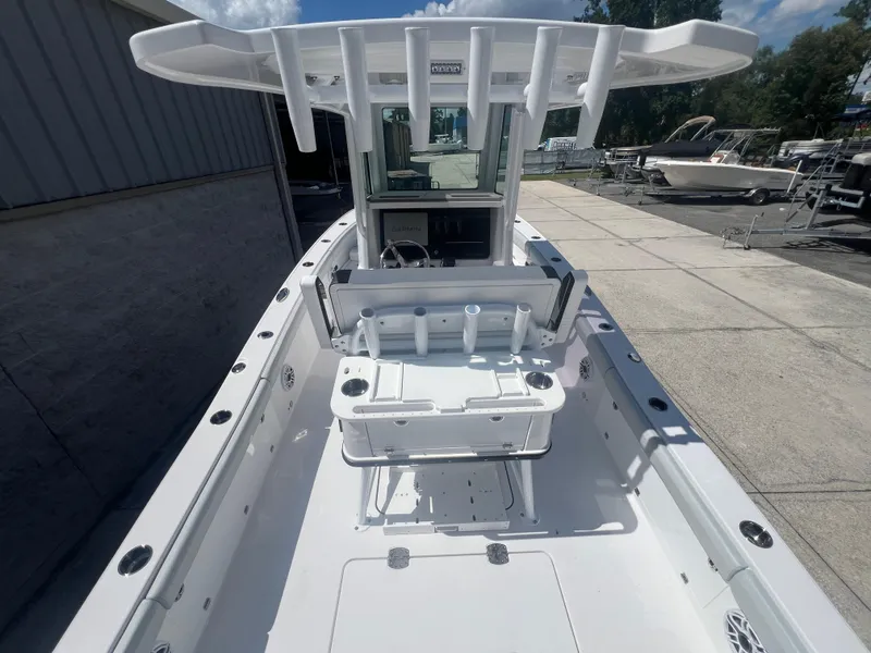 Slide: The Image of 2026 Blackfin 262 HB boat with center console and fishing rod holders. - 7