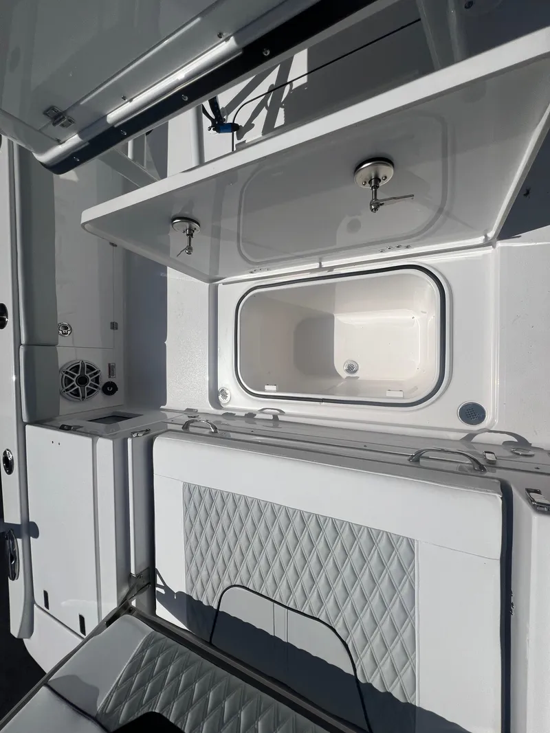 Slide: The Image of 2026 Blackfin 262 HB boat interior with storage compartments and seating. - 9
