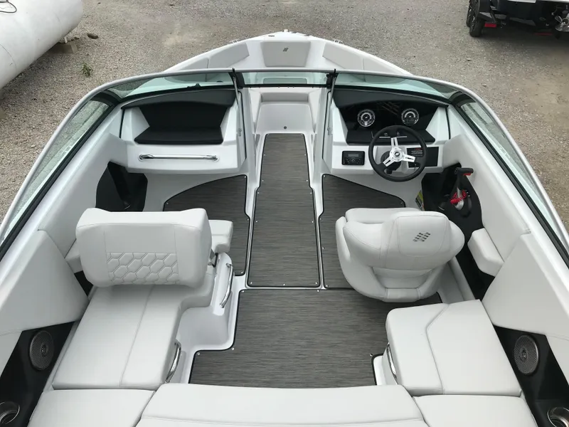 Slide: The Image of 2026 Four Winns H-2 FREEDOM boat interior with modern seating and steering wheel. - 16