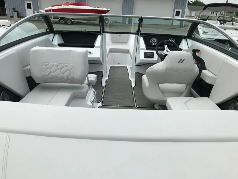 Slide: The Image of 2026 Four Winns H-2 FREEDOM boat interior with modern seating and dashboard design. - 17