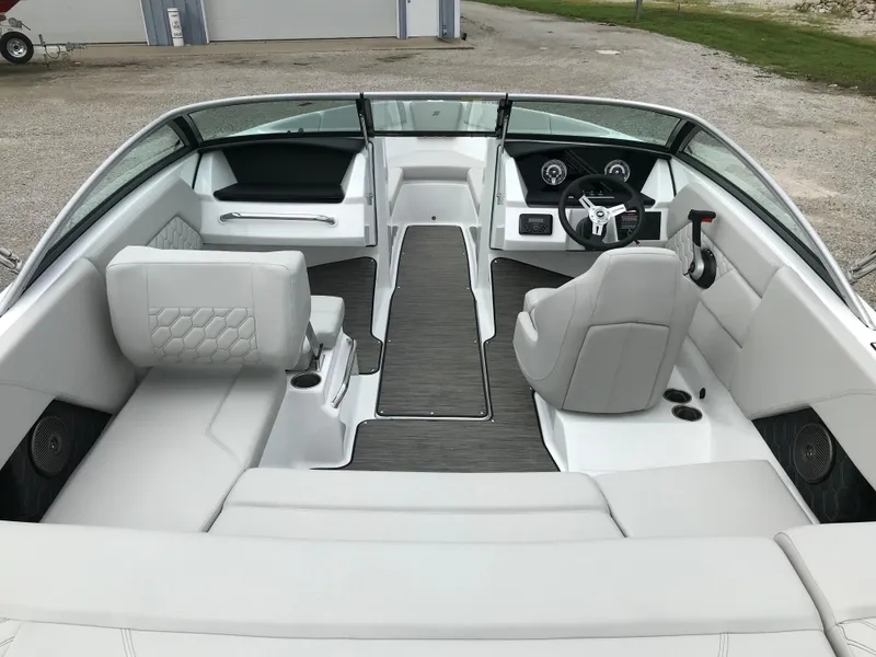 Slide: The Image of 2026 Four Winns H-2 FREEDOM boat interior with sleek seating and modern dashboard. - 18