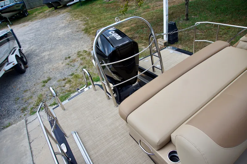Slide: The Image of 2020 Avalon Catalina Platinum Rear Lounger boat with outboard motor and beige seating. - 6