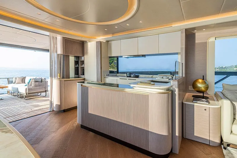 Slide: The Image of Luxurious interior of 2026 Absolute NAVETTA 70 yacht with modern kitchen and ocean view. - 11
