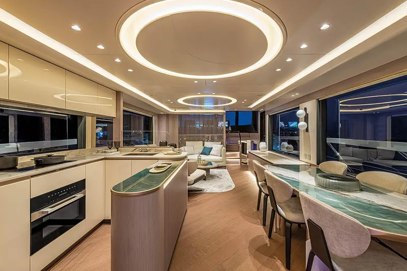 Slide: The Image of Luxurious interior of 2026 Absolute NAVETTA 70 yacht with modern kitchen and elegant dining area. - 14