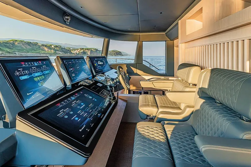 Slide: The Image of Luxurious interior of 2026 Absolute NAVETTA 70 yacht with advanced navigation displays. - 15