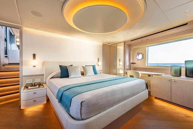 Slide: The Image of Luxurious bedroom interior on Absolute NAVETTA 70 yacht, 2026 model, featuring modern design and ocean view. - 16