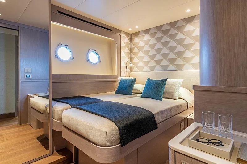 Slide: The Image of Luxurious cabin interior of 2026 Absolute NAVETTA 70 yacht with modern decor and twin beds. - 20