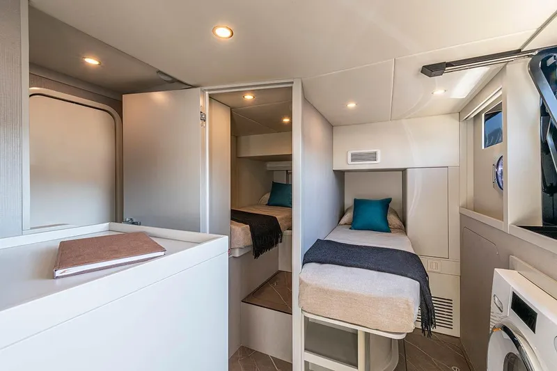 Slide: The Image of Luxurious interior of 2026 Absolute NAVETTA 70 yacht with cozy twin beds and modern amenities. - 21
