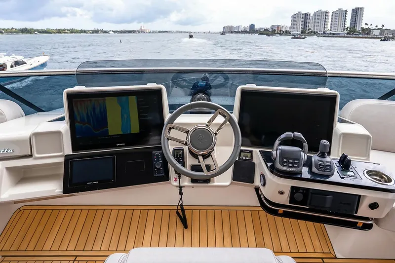 Slide: The Image of Cockpit of 2026 Absolute NAVETTA 70 yacht with advanced navigation systems and controls. - 22