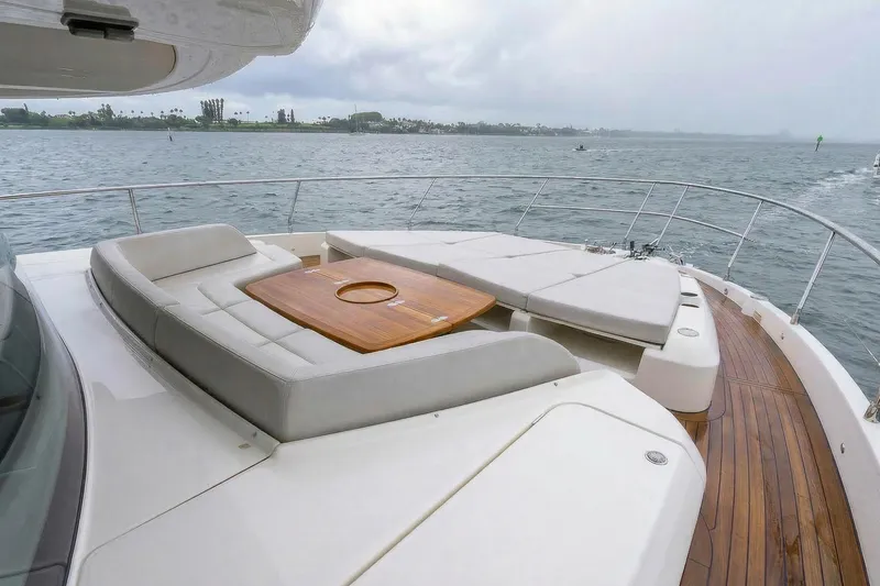 Slide: The Image of Luxurious deck of 2026 Absolute NAVETTA 70 yacht with elegant seating and ocean view. - 24