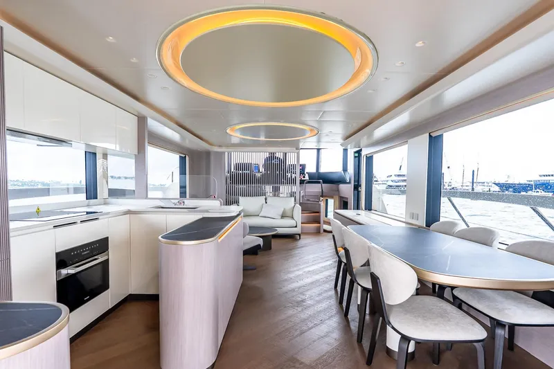 Slide: The Image of Luxurious interior of 2026 Absolute NAVETTA 70 yacht with modern kitchen and dining area. - 28
