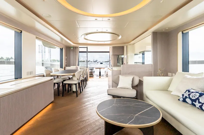 Slide: The Image of Luxurious interior of 2026 Absolute NAVETTA 70 yacht with elegant seating and dining area. - 36