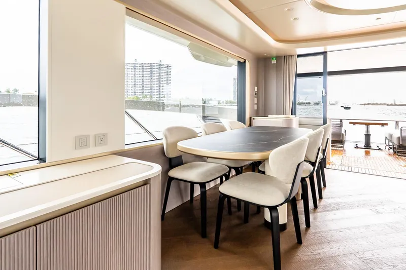 Slide: The Image of Luxurious interior of 2026 Absolute NAVETTA 70 yacht with elegant dining area and waterfront view. - 38