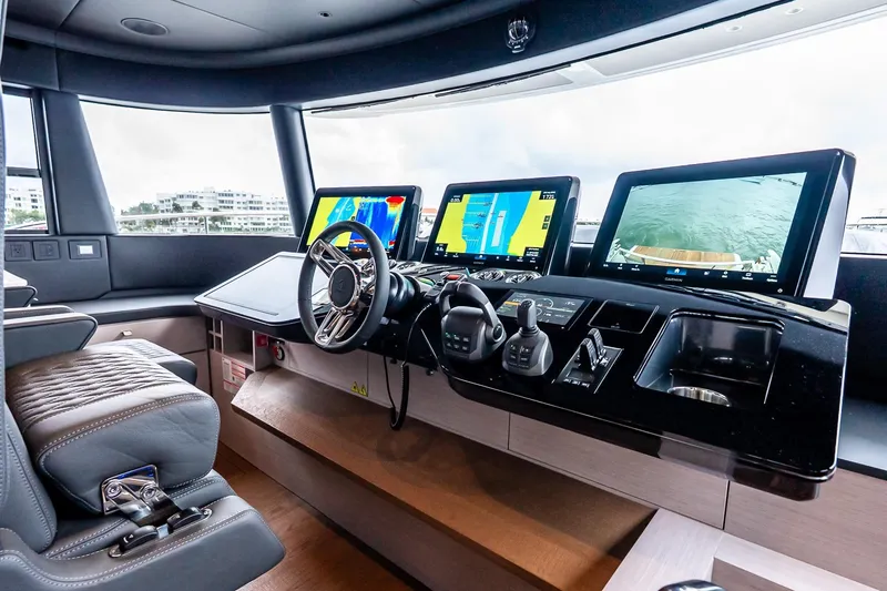 Slide: The Image of Cockpit of 2026 Absolute NAVETTA 70 yacht with advanced navigation displays and controls. - 44