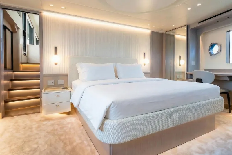 Slide: The Image of Luxurious bedroom interior on Absolute NAVETTA 70 yacht, 2026 model, featuring modern design and ambient lighting. - 48