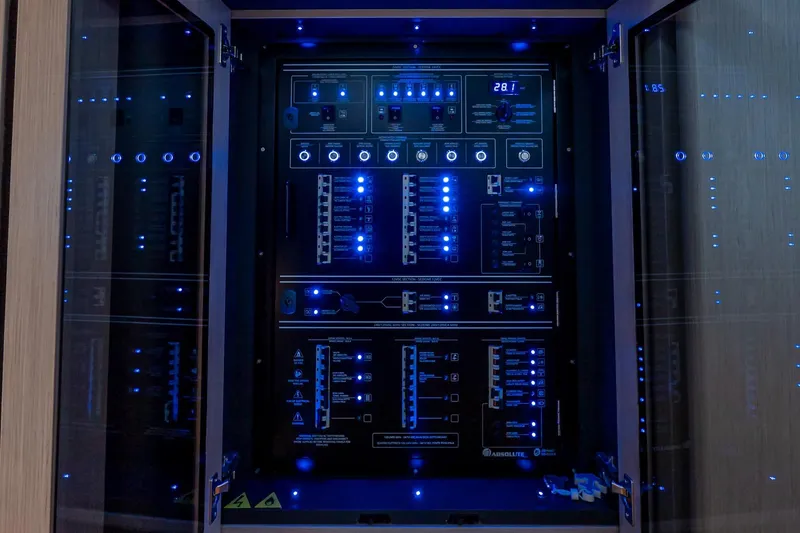 Slide: The Image of Electrical control panel with blue LED lights on Absolute NAVETTA 70 yacht, 2026 model. - 56