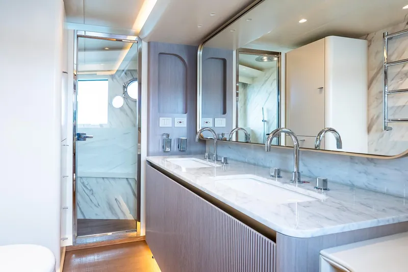 Slide: The Image of Luxurious bathroom on Absolute NAVETTA 70 yacht, featuring dual sinks and modern fixtures, 2026 model. - 57
