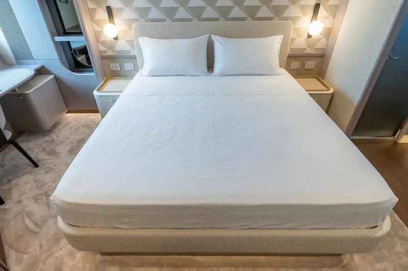 Slide: The Image of Luxurious bedroom interior on Absolute NAVETTA 70 yacht, 2026 model, featuring modern design. - 61