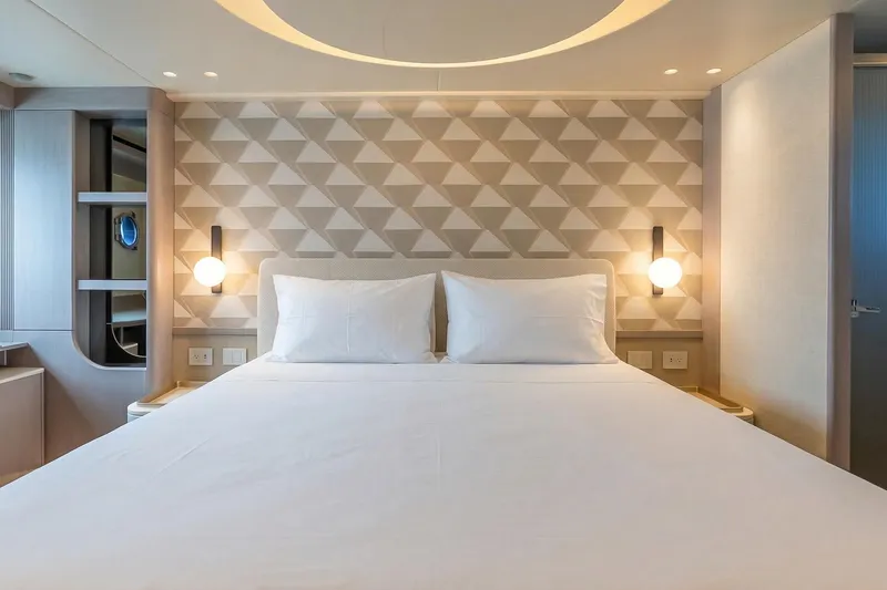 Slide: The Image of Luxurious bedroom interior on Absolute NAVETTA 70 yacht, 2026 model, featuring modern design elements. - 62