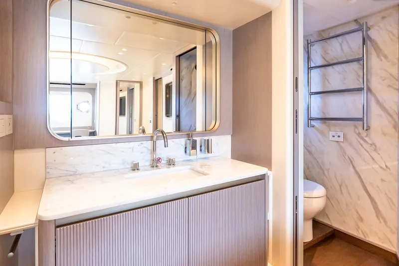 Slide: The Image of Luxurious bathroom interior on Absolute NAVETTA 70 yacht, featuring marble sink and modern fixtures. - 67