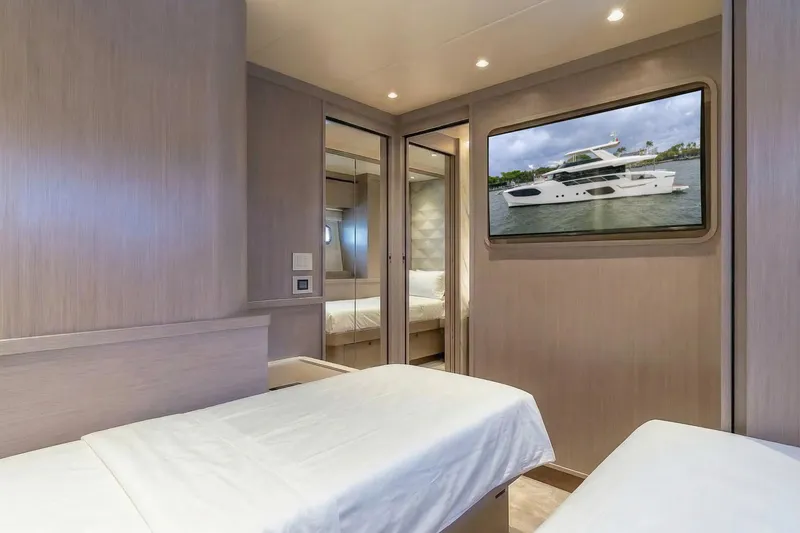 Slide: The Image of Luxurious cabin interior of 2026 Absolute NAVETTA 70 yacht with modern decor and TV display. - 73