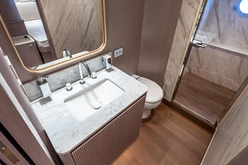 Slide: The Image of Luxurious bathroom in 2026 Absolute NAVETTA 70 yacht with marble sink and modern fixtures. - 75