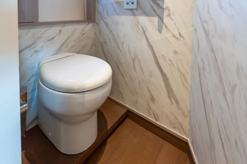 Slide: The Image of Modern bathroom with marble walls on Absolute NAVETTA 70 yacht, 2026 model. - 76