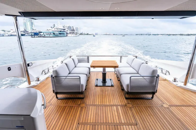 Slide: The Image of Luxurious deck of 2026 Absolute NAVETTA 70 yacht with elegant seating and ocean view. - 10