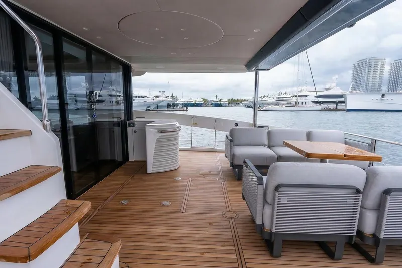 Slide: The Image of Luxurious Absolute NAVETTA 70 yacht deck with modern control panel, 2026 model. - 14