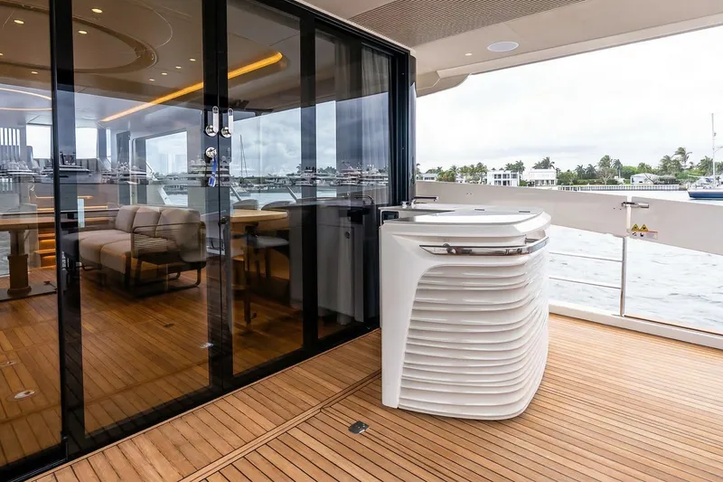 Slide: The Image of Aerial view of 2026 Absolute NAVETTA 70 yacht with solar panels and deck seating. - 15