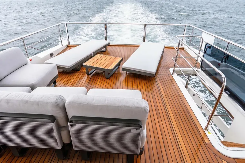 Slide: The Image of Luxurious deck of 2026 Absolute NAVETTA 70 yacht with elegant seating and ocean view. - 19
