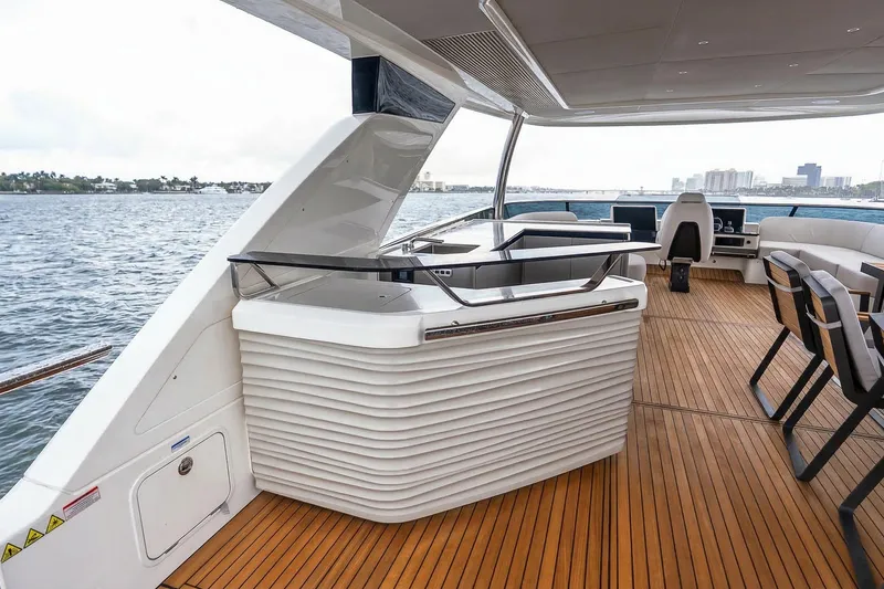 Slide: The Image of Outdoor kitchen area on Absolute NAVETTA 70 yacht, featuring stainless steel appliances, 2026 model. - 20