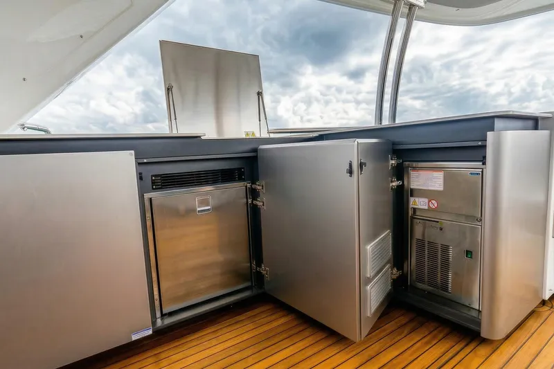 Slide: The Image of Luxurious 2026 Absolute NAVETTA 70 yacht interior with panoramic ocean view and plush seating. - 22