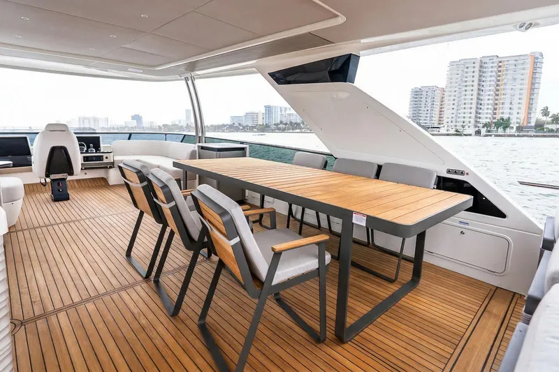Slide: The Image of Luxurious seating area on the 2026 Absolute NAVETTA 70 yacht with ocean view. - 23