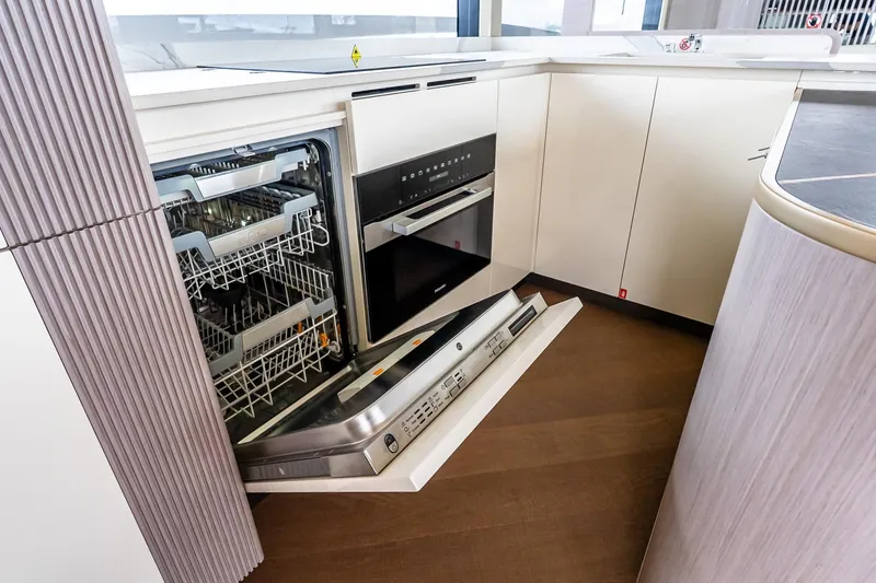 Slide: The Image of Luxurious kitchen interior of 2026 Absolute NAVETTA 70 yacht with modern design and panoramic window. - 35