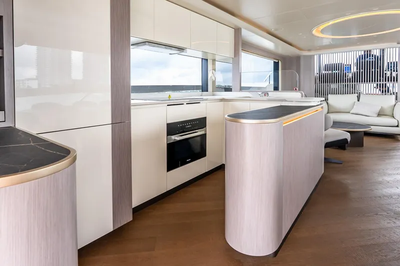 Slide: The Image of Luxurious interior of 2026 Absolute NAVETTA 70 yacht with elegant seating and dining area. - 38