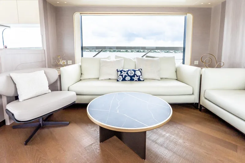 Slide: The Image of Luxurious interior of 2026 Absolute NAVETTA 70 yacht with elegant dining area and panoramic windows. - 41
